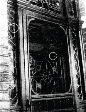 Door to Churchill Avenue house, showing bullet hole